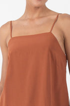 Close-up of the neckline showcasing clean finishing and refined stitching detail