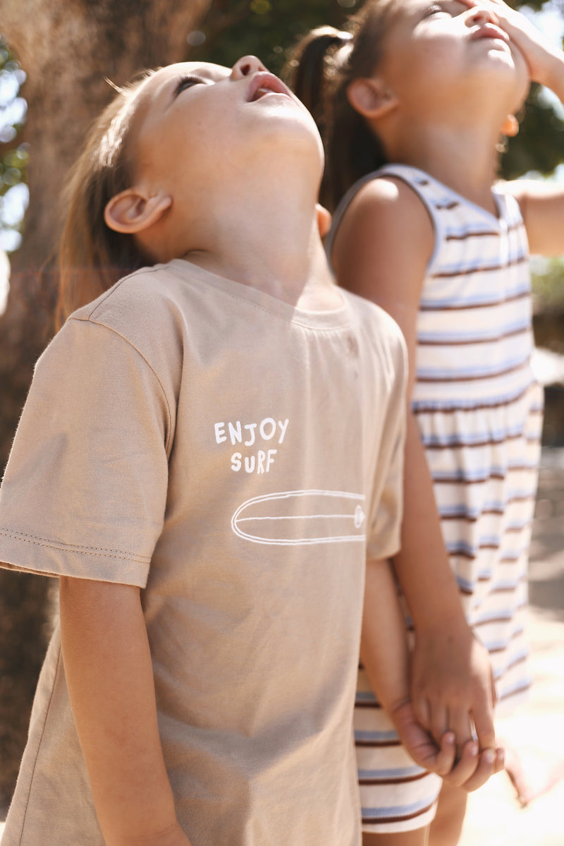 Relaxed island styling featuring the Kai Boys Cotton T-shirt Surfboard