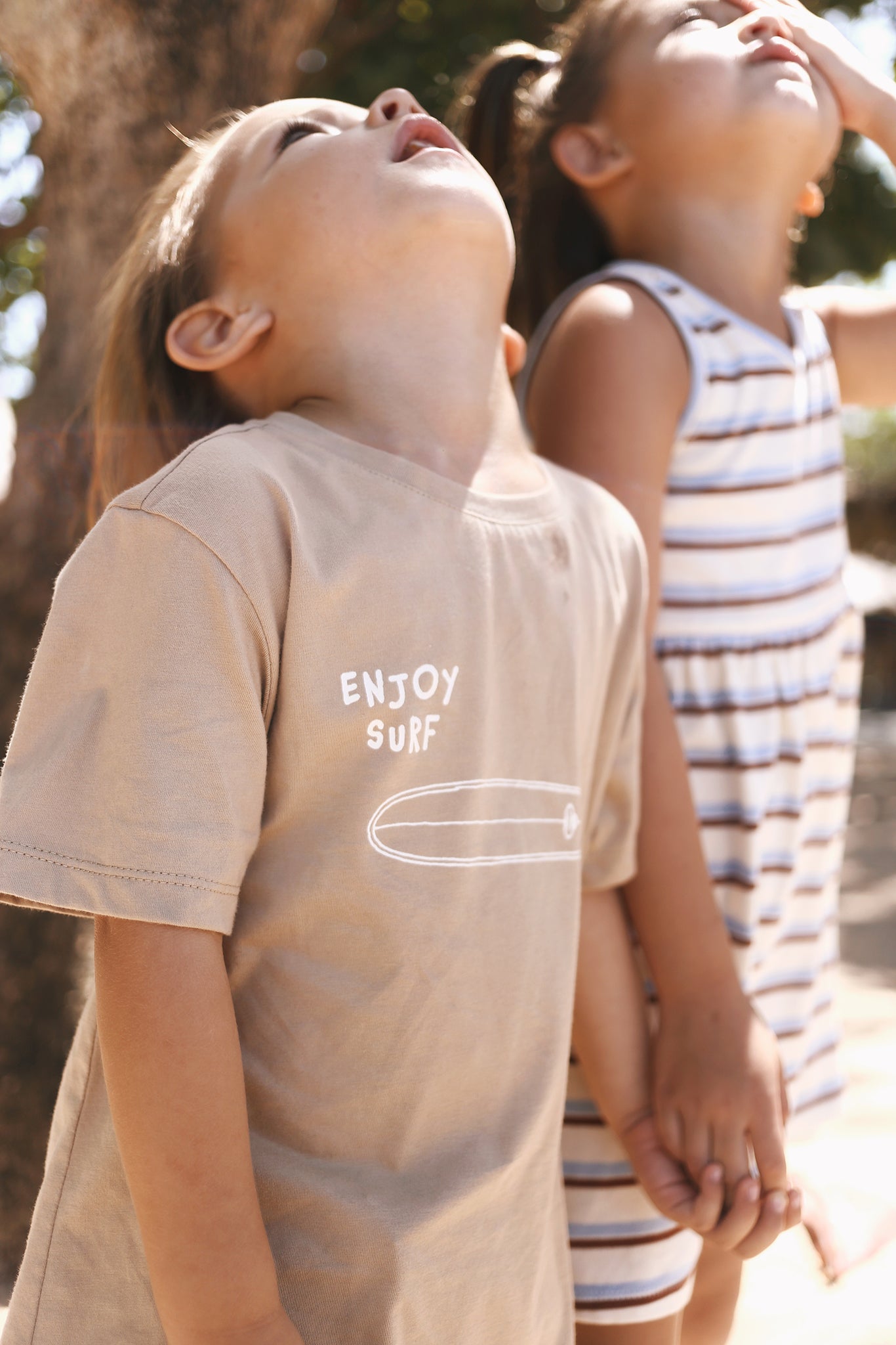Relaxed island styling featuring the Kai Boys Cotton T-shirt Surfboard