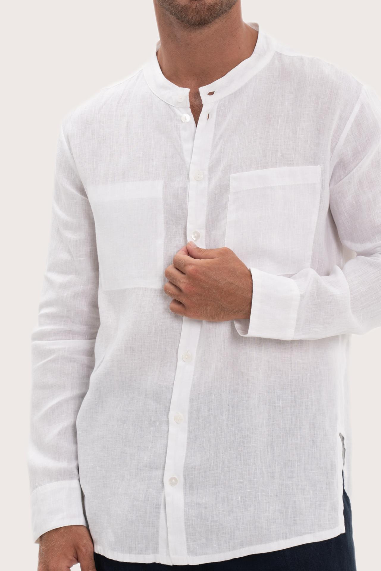 Close-up of the linen fabric texture and refined tailoring details on the white shirt