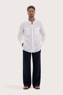 Model wearing the white linen Abra shirt by By The Sea Bali