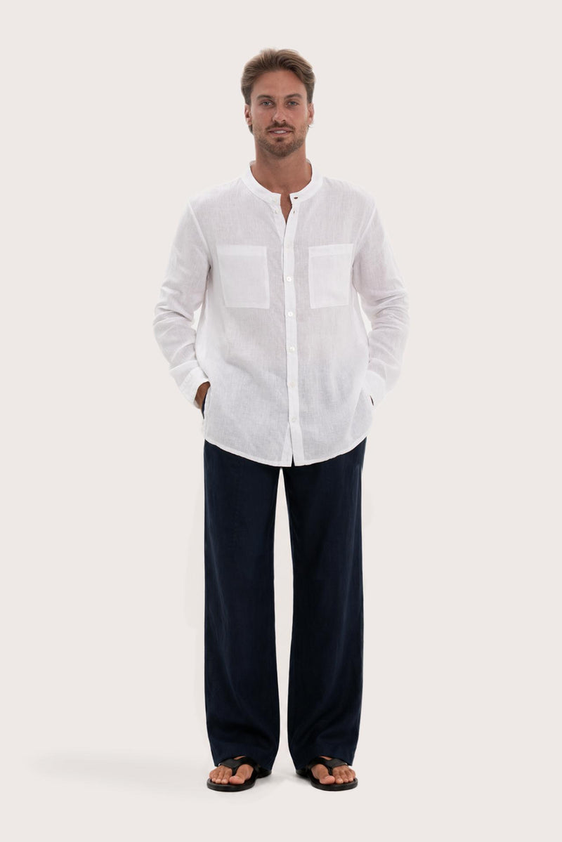 Model wearing the white linen Abra shirt by By The Sea Bali