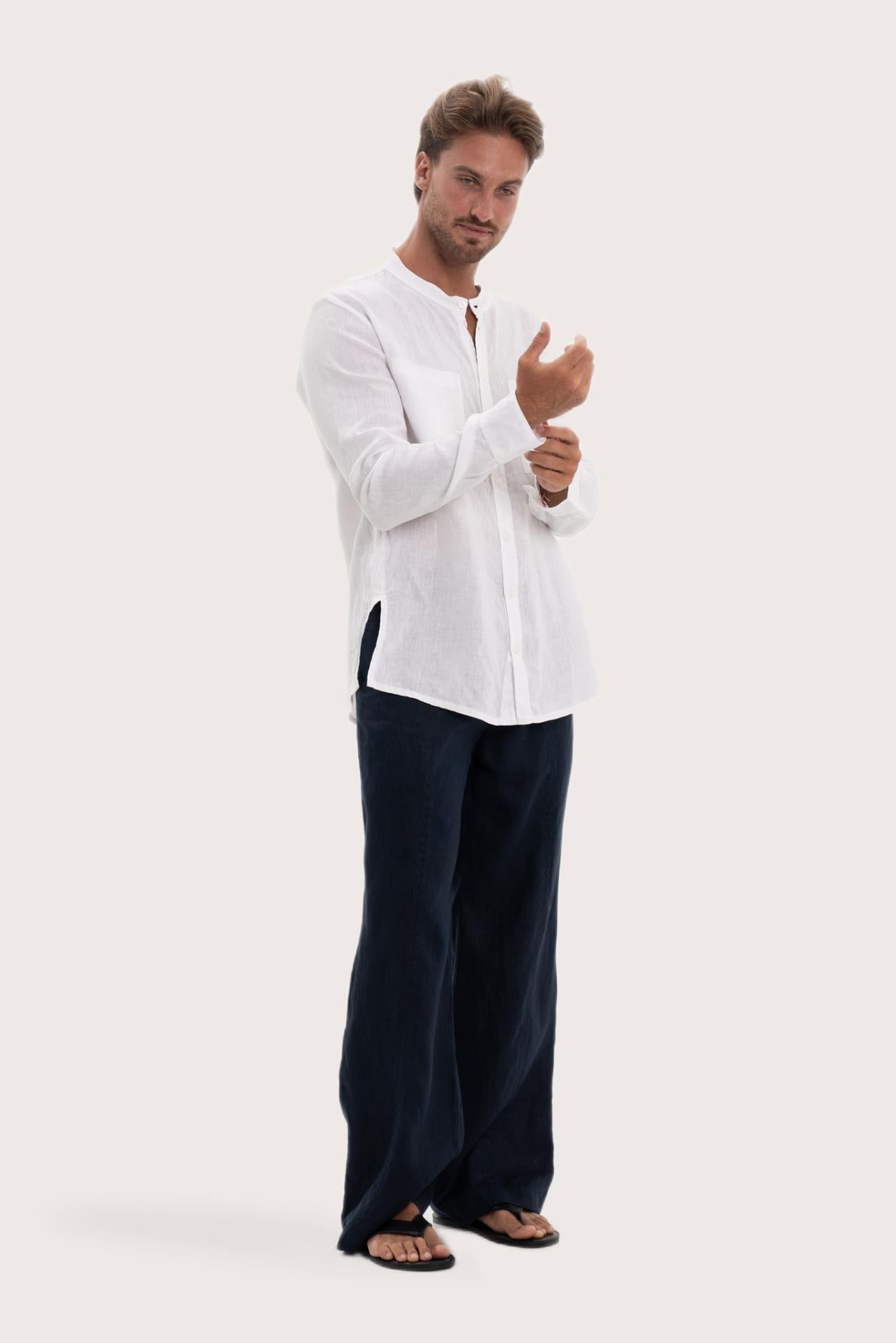 Side profile of the white linen Abra shirt showcasing its effortless drape and comfortable fit