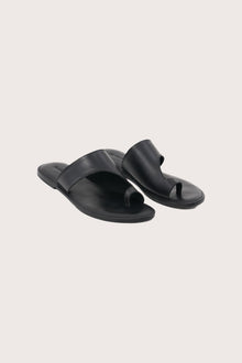 Aida sandal in black front view showcasing elegant straps and minimalist resort aesthetic