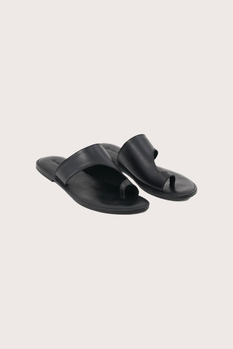 Aida sandal in black front view showcasing elegant straps and minimalist resort aesthetic