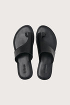 Aida sandal in black shown in a global view highlighting its full silhouette and refined resort design