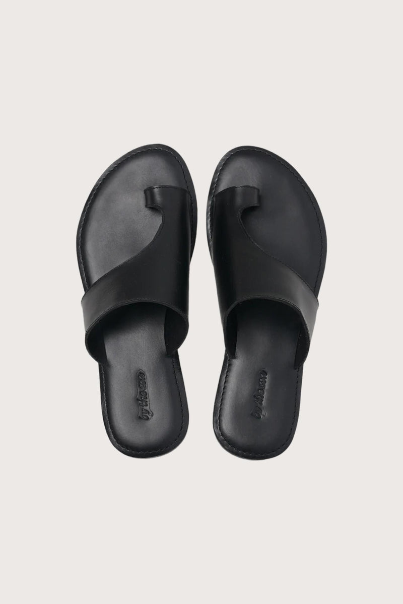 Aida sandal in black shown in a global view highlighting its full silhouette and refined resort design