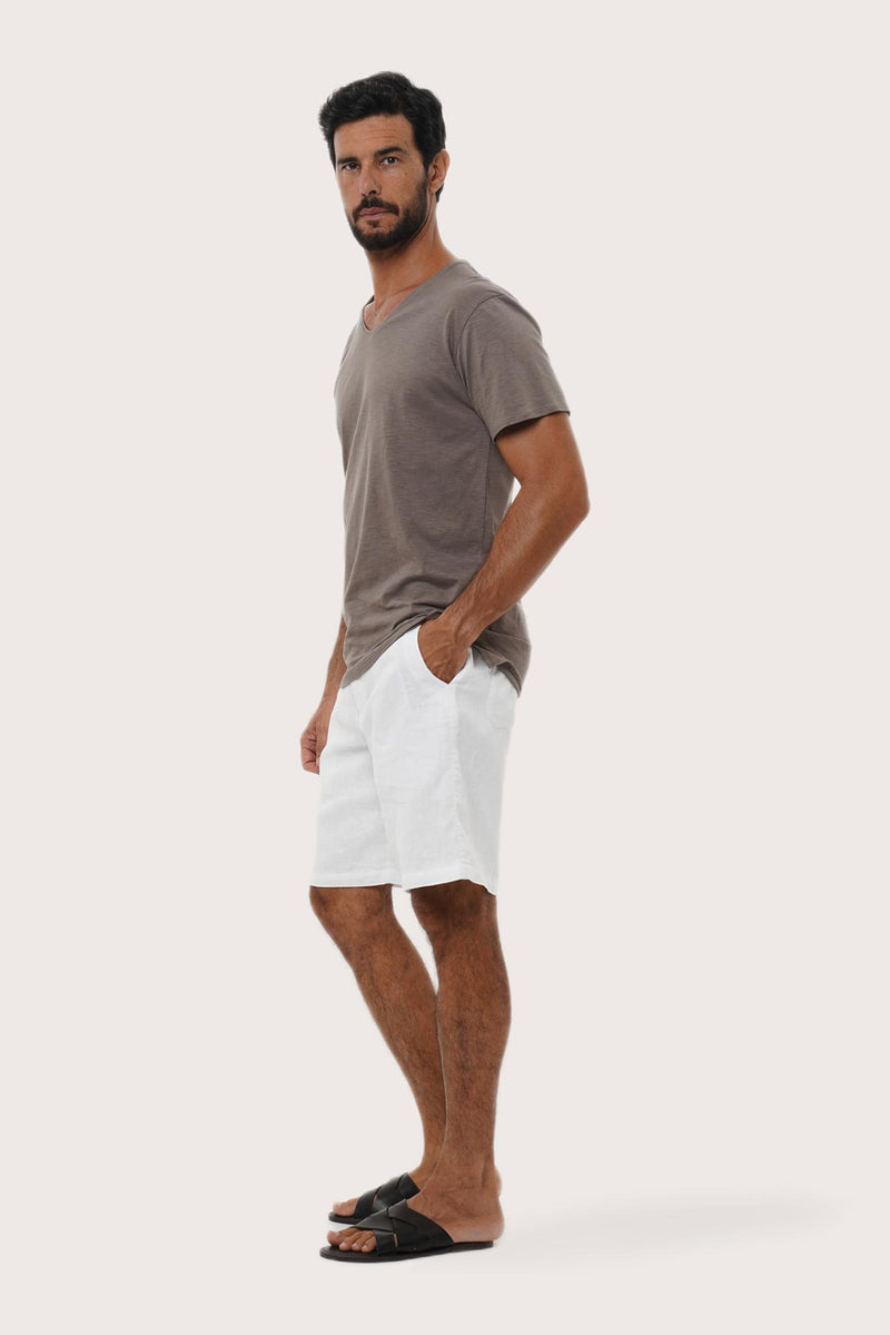Side profile of the Aling Cotton T-shirt Brown by By The Sea Bali – relaxed drape and understated island elegance