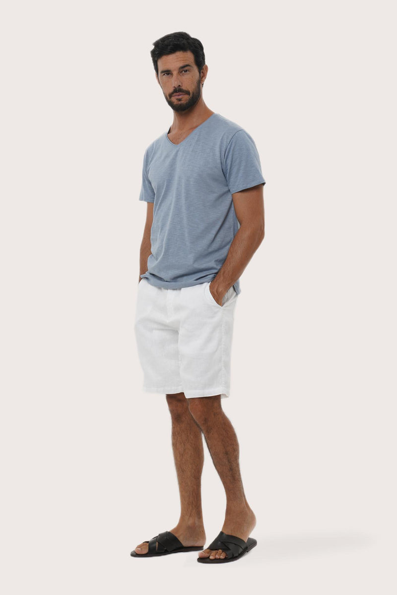 Side profile of the Aling Cotton T-shirt Light Blue by By The Sea Bali – relaxed drape and understated island elegance