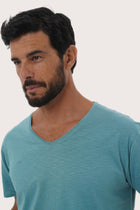 Close-up of the Aling Cotton T-shirt Light Green Forest by By The Sea Bali – exceptional fabric quality and texture