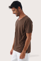 Side profile of the Aling T-Shirt Brun by By The Sea Bali – relaxed drape and understated island elegance