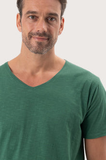 Close-up of the Aling T-Shirt Green by By The Sea Bali – exceptional fabric quality and texture