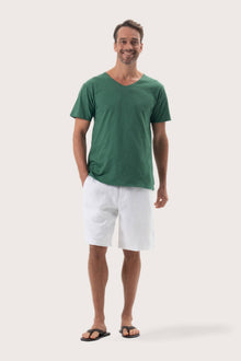 Aling T-Shirt Green by By The Sea Bali – angled front view showcasing the tailored island silhouette