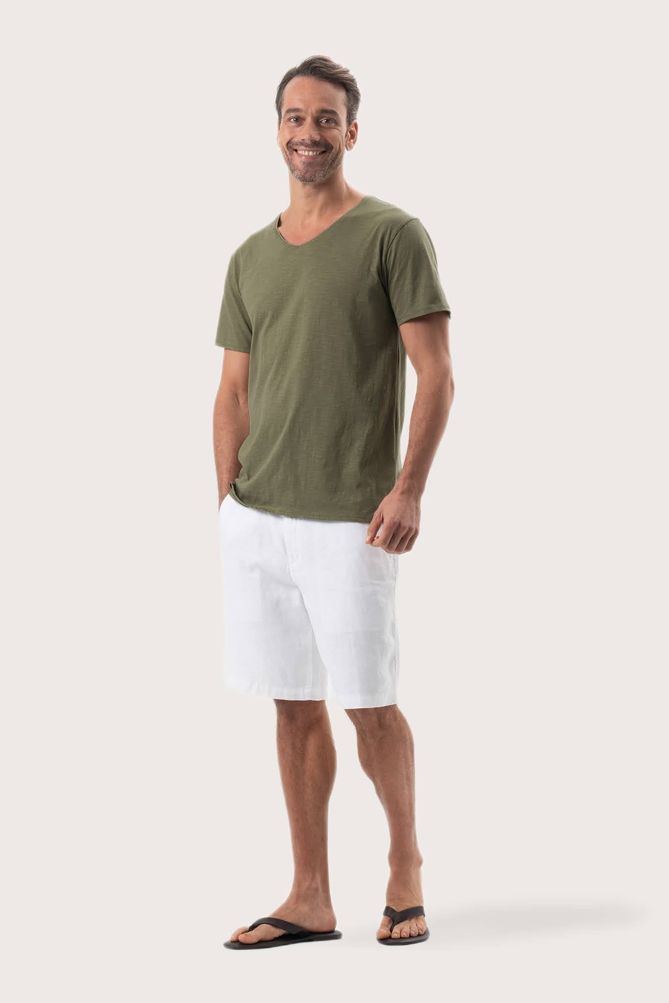 Side profile of the Aling T-Shirt Khaki by By The Sea Bali – relaxed drape and understated island elegance