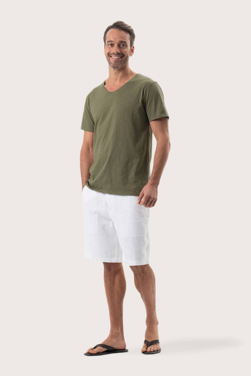 Side profile of the Aling T-Shirt Khaki by By The Sea Bali – relaxed drape and understated island elegance
