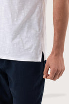 Back detail of the Aling T-Shirt White by By The Sea Bali – premium stitching and artisan quality