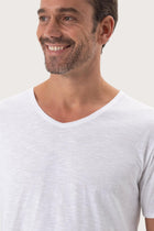 Close-up of the Aling T-Shirt White by By The Sea Bali – exceptional fabric quality and texture