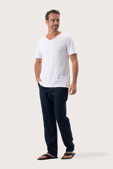 Side profile of the Aling T-Shirt White by By The Sea Bali – relaxed drape and understated island elegance