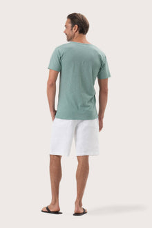 Back view of the By The Sea Bali Aling T-Shirt Sage – clean tailoring and refined craftsmanship