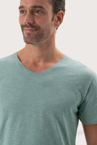 Close-up of the Aling T-Shirt Sage by By The Sea Bali – exceptional fabric quality and texture