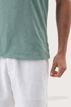 Premium fabric texture of the Aling T-Shirt Sage by By The Sea Bali – artisanal quality