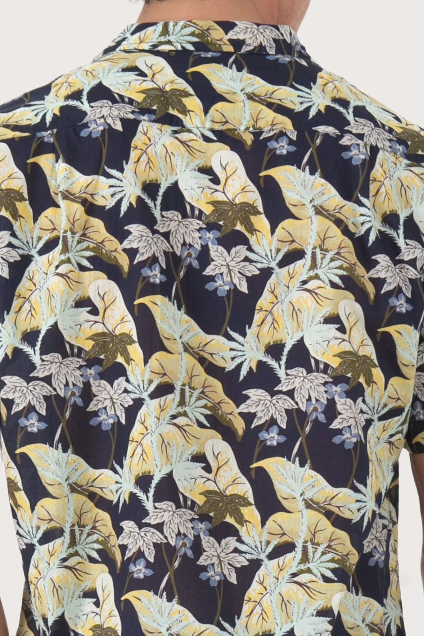 Open collar and button-front detail of the Alola Cotton Shirt Sivala Navy by By The Sea Bali