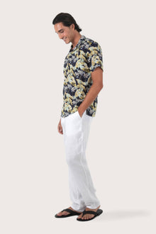 Side-angle view of the Alola Cotton Shirt Sivala Navy showing its relaxed drape by By The Sea Bali