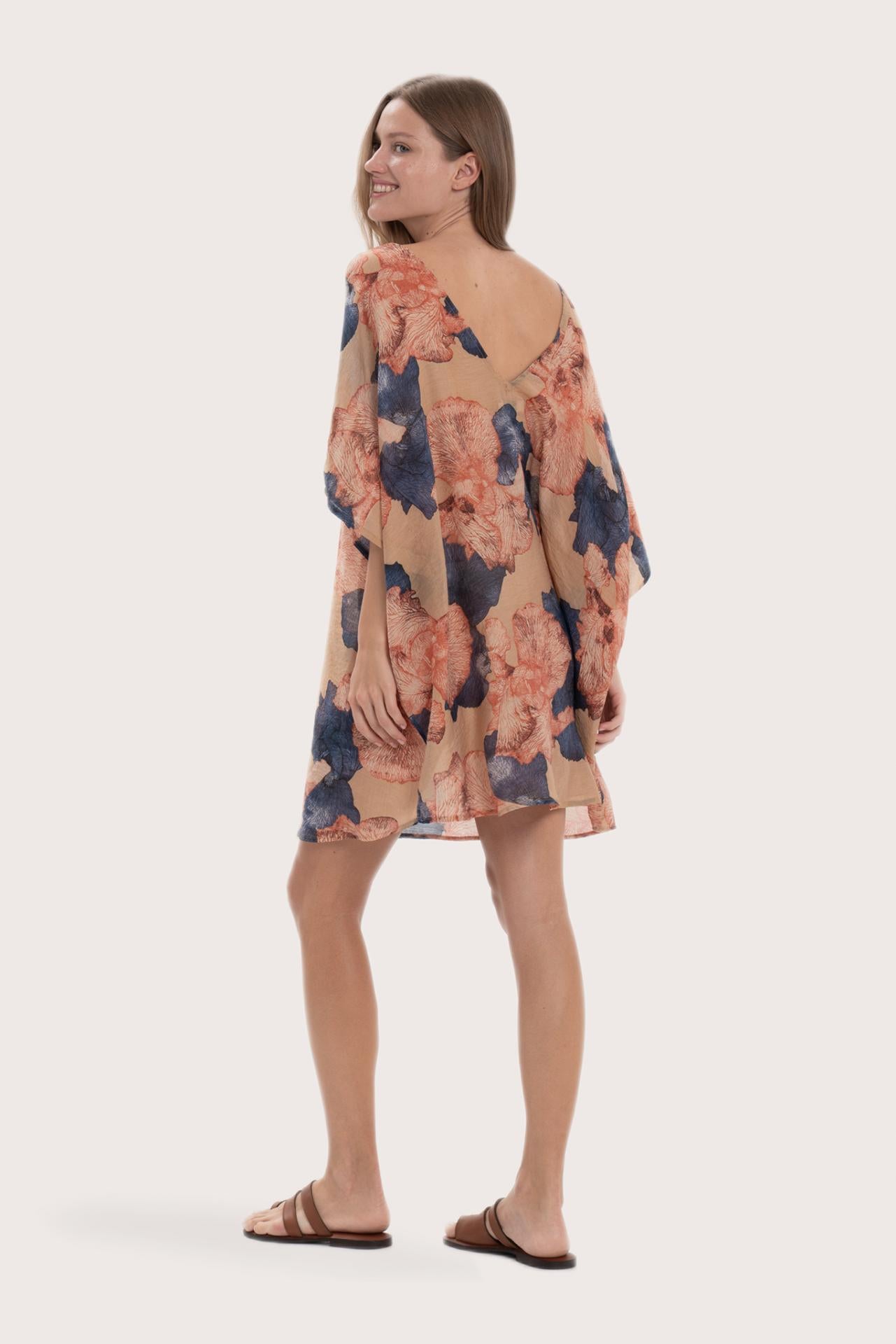 Back view of the light brown Malva short kaftan with a relaxed flowing silhouette
