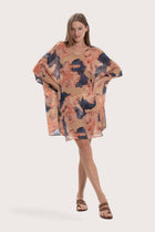 Model wearing the light brown Malva Alur short kaftan by By The Sea Bali