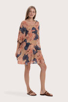 Side profile of the light brown Malva short kaftan showcasing its lightweight drape