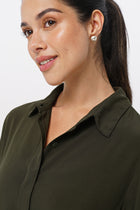 Close up detail of the Amalia Side Slit Shirt Army Green highlighting craftsmanship and design features.