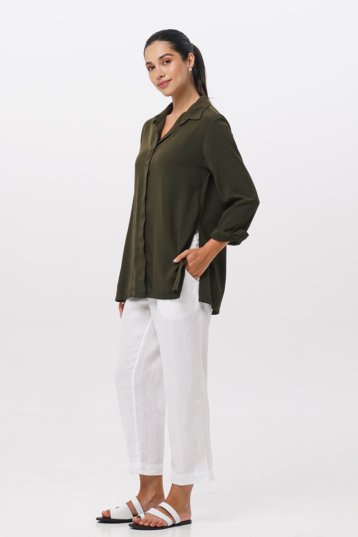Side profile of the Amalia Side Slit Shirt Army Green showing its cut and natural movement.