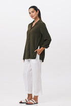 Side profile of the Amalia Side Slit Shirt Army Green showing its cut and natural movement.