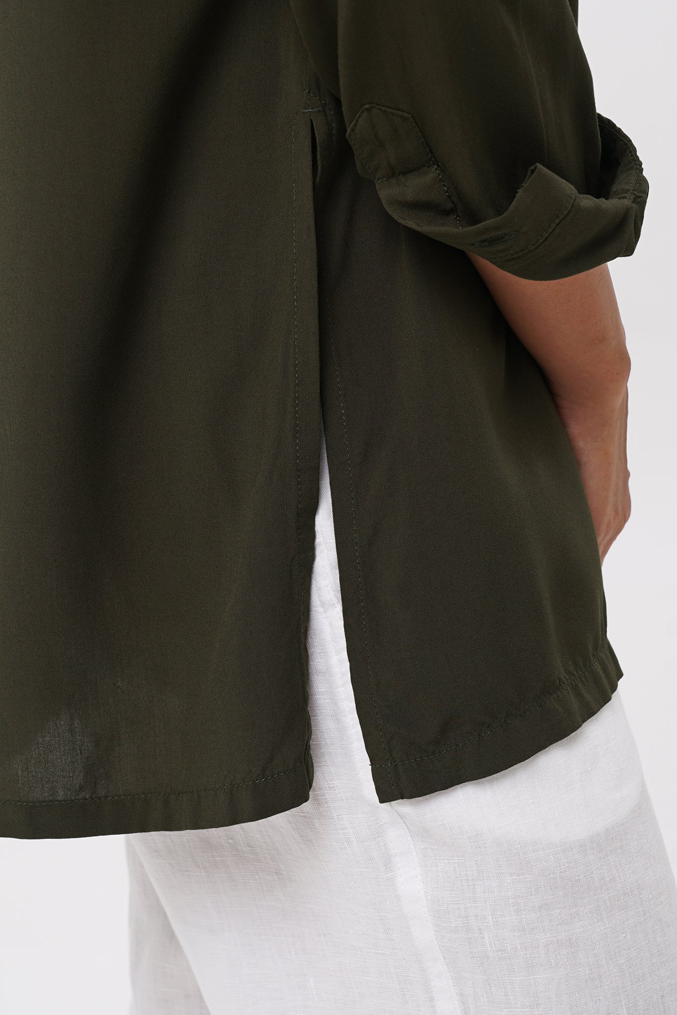 Close up detail of the Amalia Side Slit Shirt Army Green highlighting craftsmanship and design features.