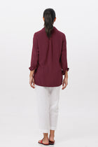 Back view of the Amalia Side Slit Shirt Brick highlighting the garment shape and drape.