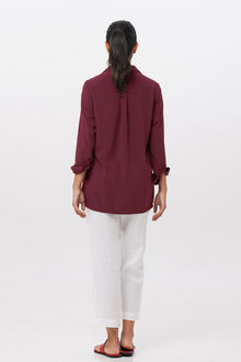 Back view of the Amalia Side Slit Shirt Brick highlighting the garment shape and drape.