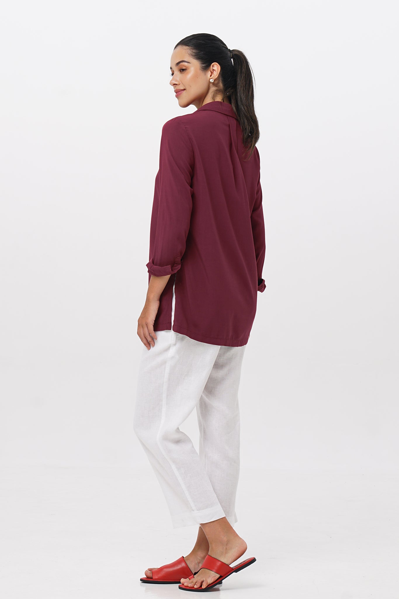 Side profile of the Amalia Side Slit Shirt Brick showing its cut and natural movement.