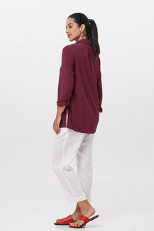 Side profile of the Amalia Side Slit Shirt Brick showing its cut and natural movement.
