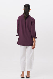Back view of the Amalia Side Slit Shirt Dark Purple highlighting the garment shape and drape.
