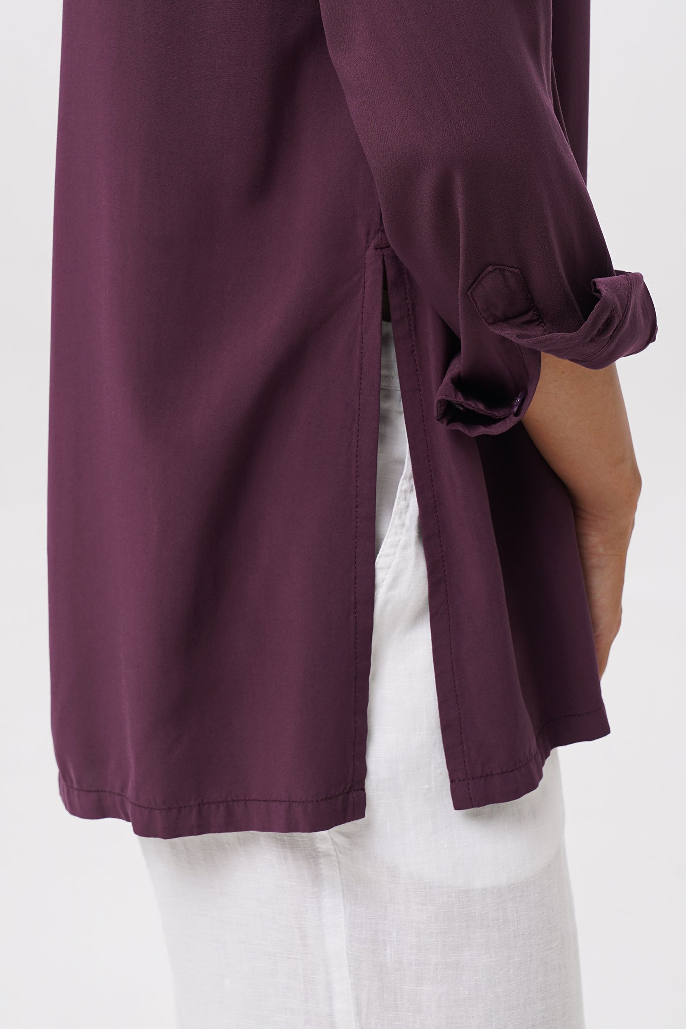 Close up detail of the Amalia Side Slit Shirt Dark Purple highlighting craftsmanship and design features.