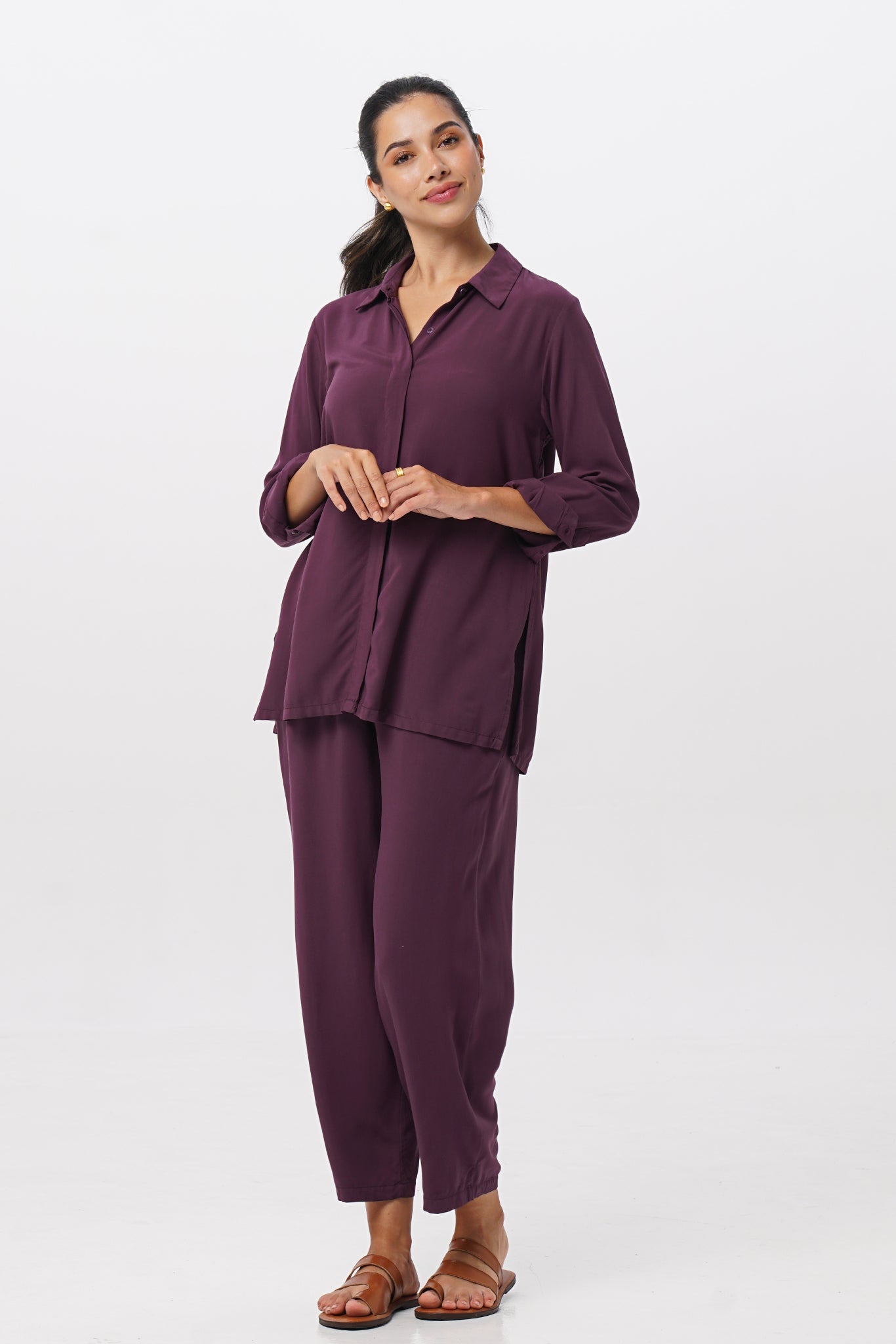 Front view of the Amalia Side Slit Shirt Dark Purple with matching color pants showing its cut and natural movement.