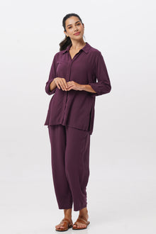 Front view of the Amalia Side Slit Shirt Dark Purple with matching color pants showing its cut and natural movement.