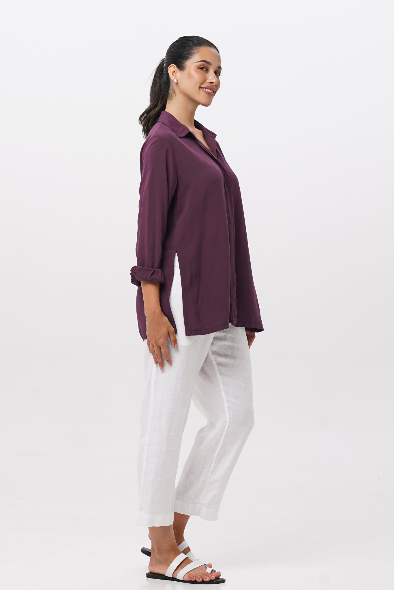 Side profile of the Amalia Side Slit Shirt Dark Purple showing its cut and natural movement.