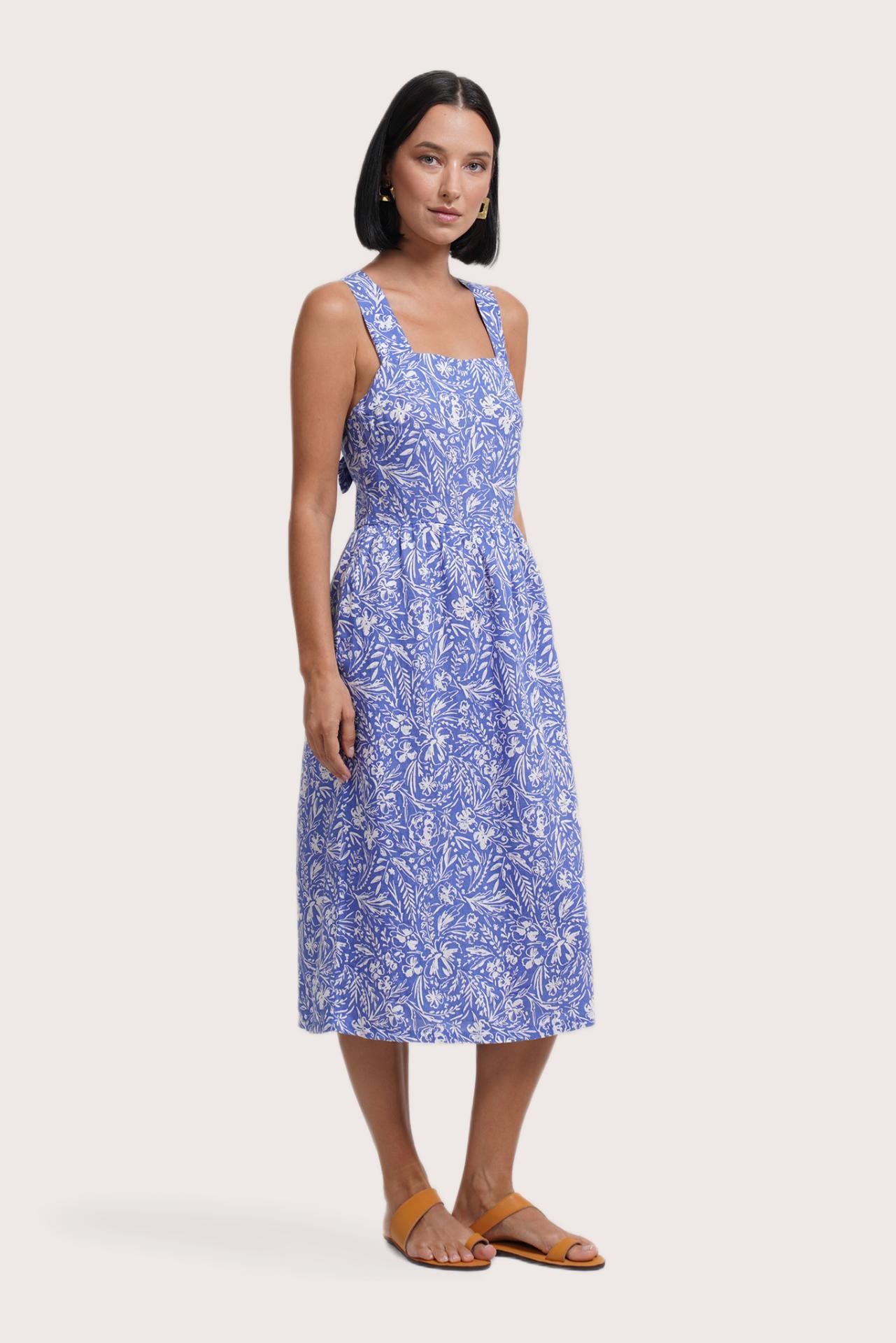 Side profile of the Amara Linen Dress Jungle Leave Light Blue showing its cut and natural movement