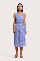 Woman wearing the Amara Linen Dress Jungle Leave Light Blue designed for effortless resortwear and tropical living by By The Sea Bali