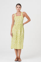 Woman wearing the Amara Linen Dress Jungle Leave Light Green designed for effortless resortwear and tropical living by By The Sea Bali