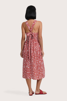 Back view of the Amara Linen Dress Jungle Leave Red Brick highlighting the garment shape and drape