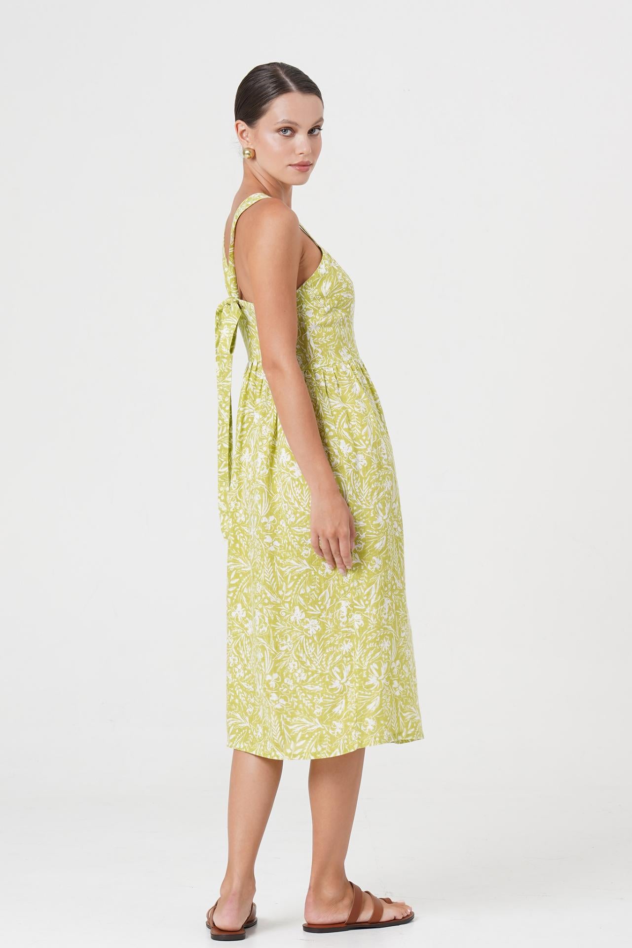 Back view of the Amara Linen Dress Jungle Leave Light Green highlighting the garment shape and drape