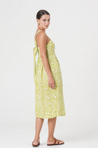 Back view of the Amara Linen Dress Jungle Leave Light Green highlighting the garment shape and drape