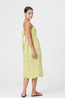 Back view of the Amara Linen Dress Jungle Leave Light Green highlighting the garment shape and drape